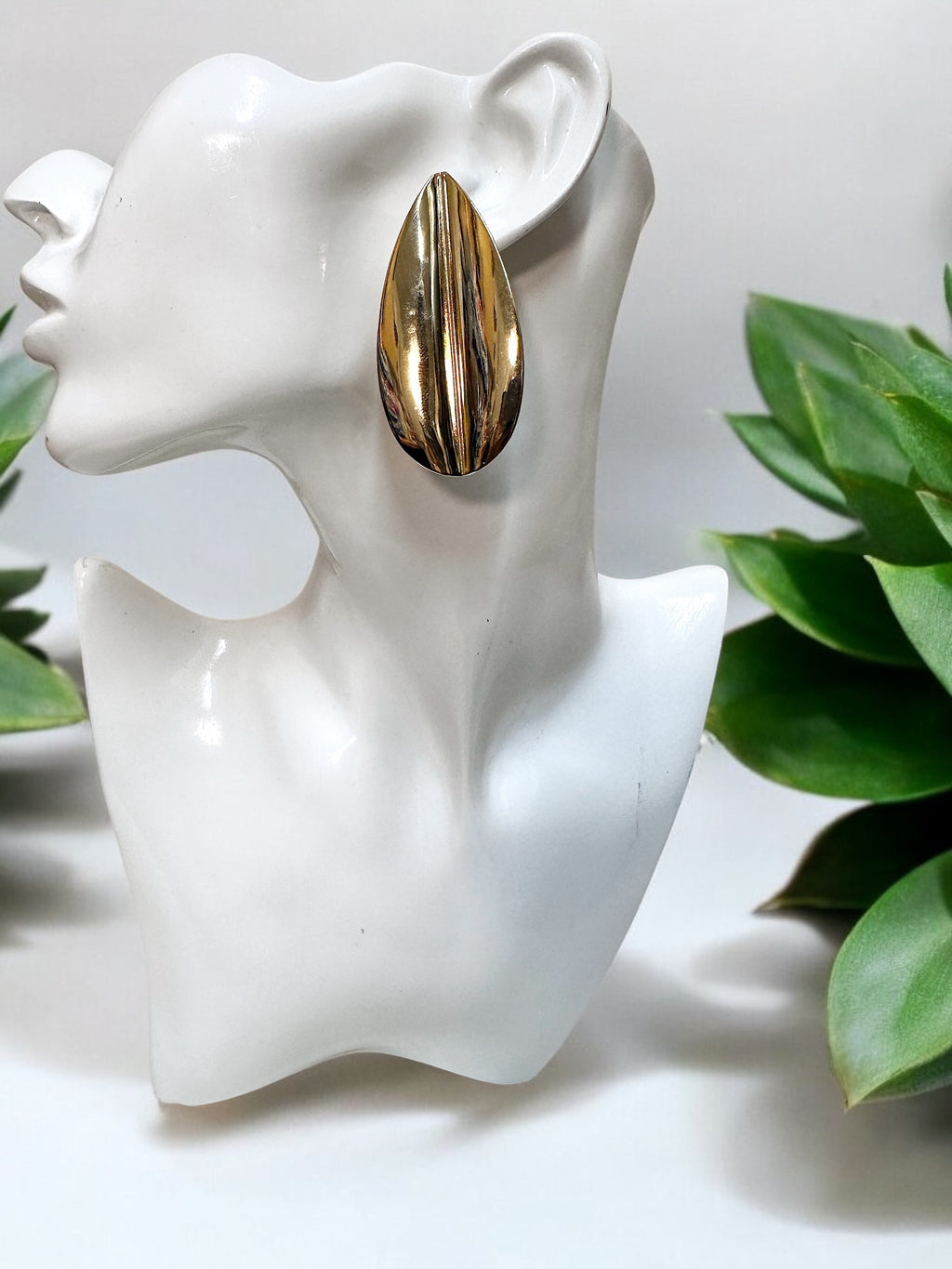 Oversized gold plated over brass leaf statement earrings for pierced ears.