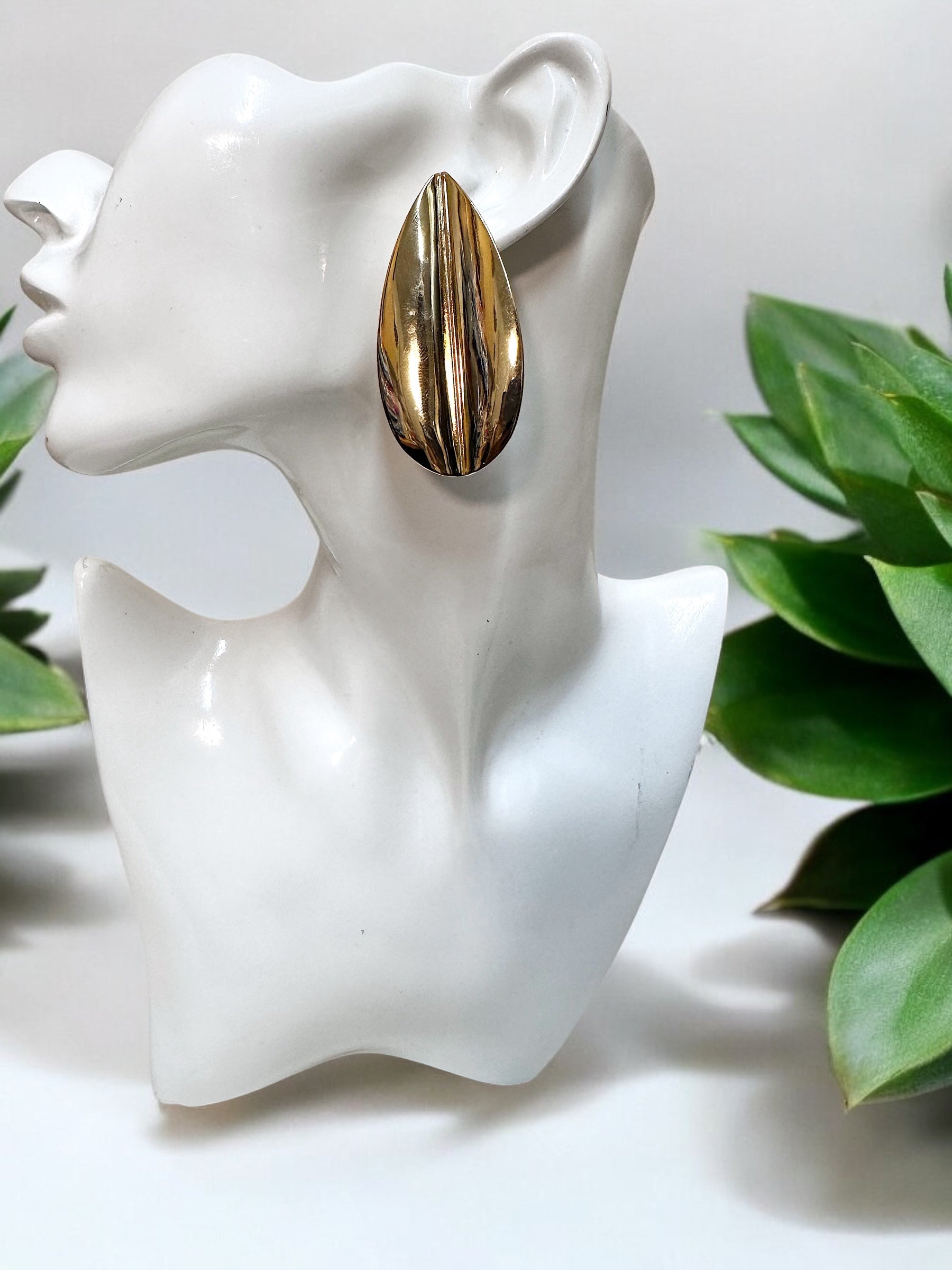 Oversized gold plated over brass leaf statement earrings for pierced ears.