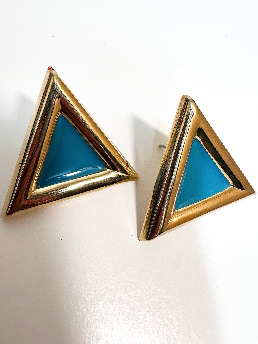 Turquoise enamel gold tone triangular stud earrings for pierced ears.