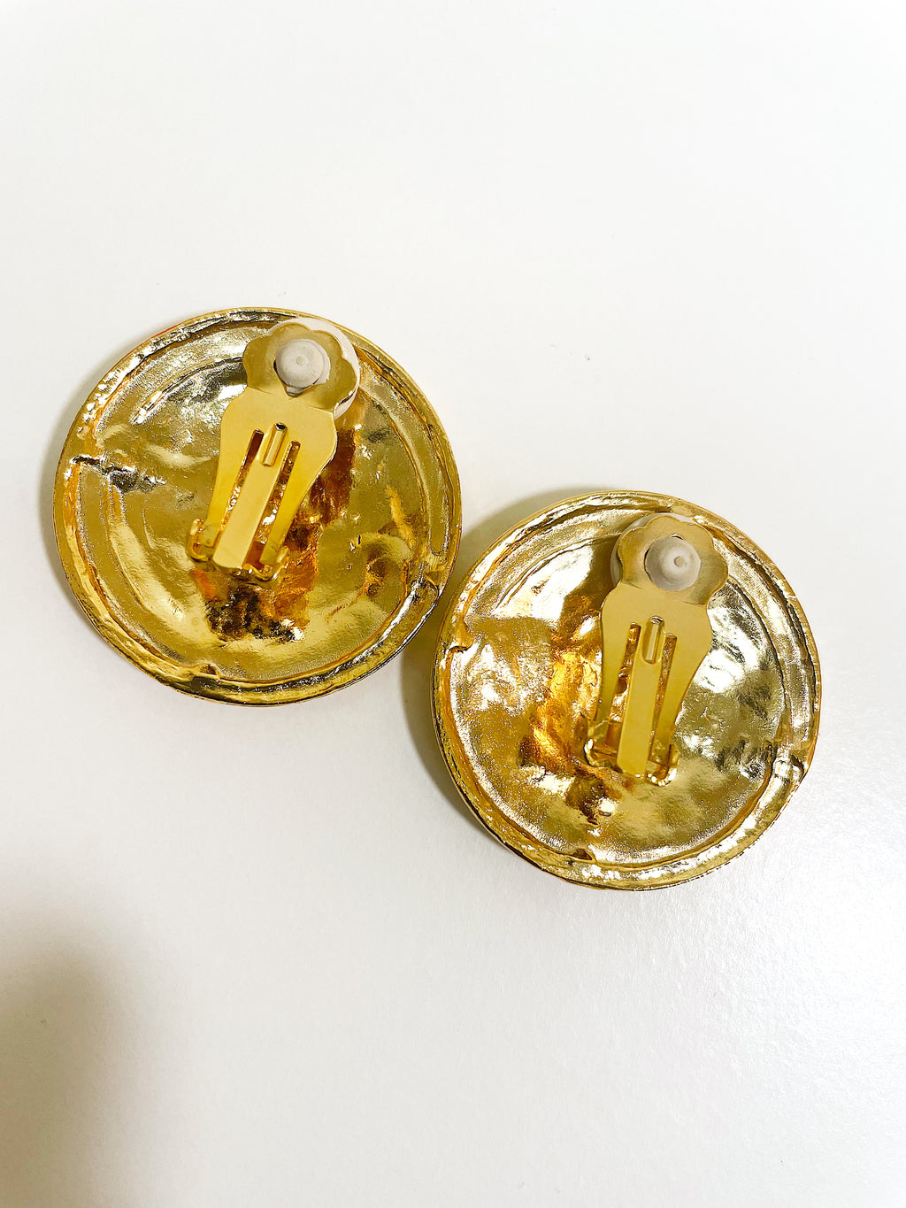 Large gold plated round swirl disc button clip on earrings.