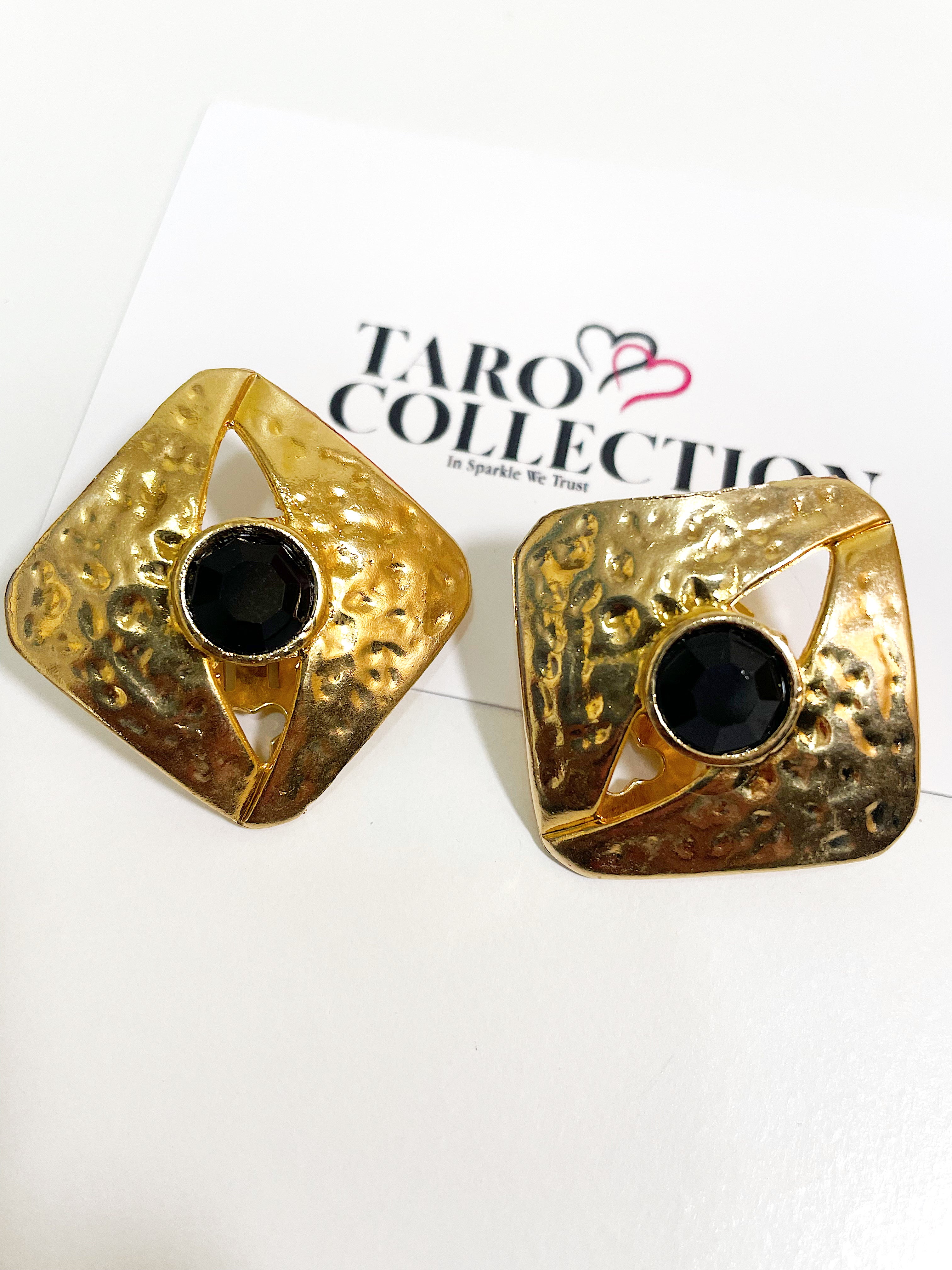 Large textured gold square earrings with black crystal stone.
