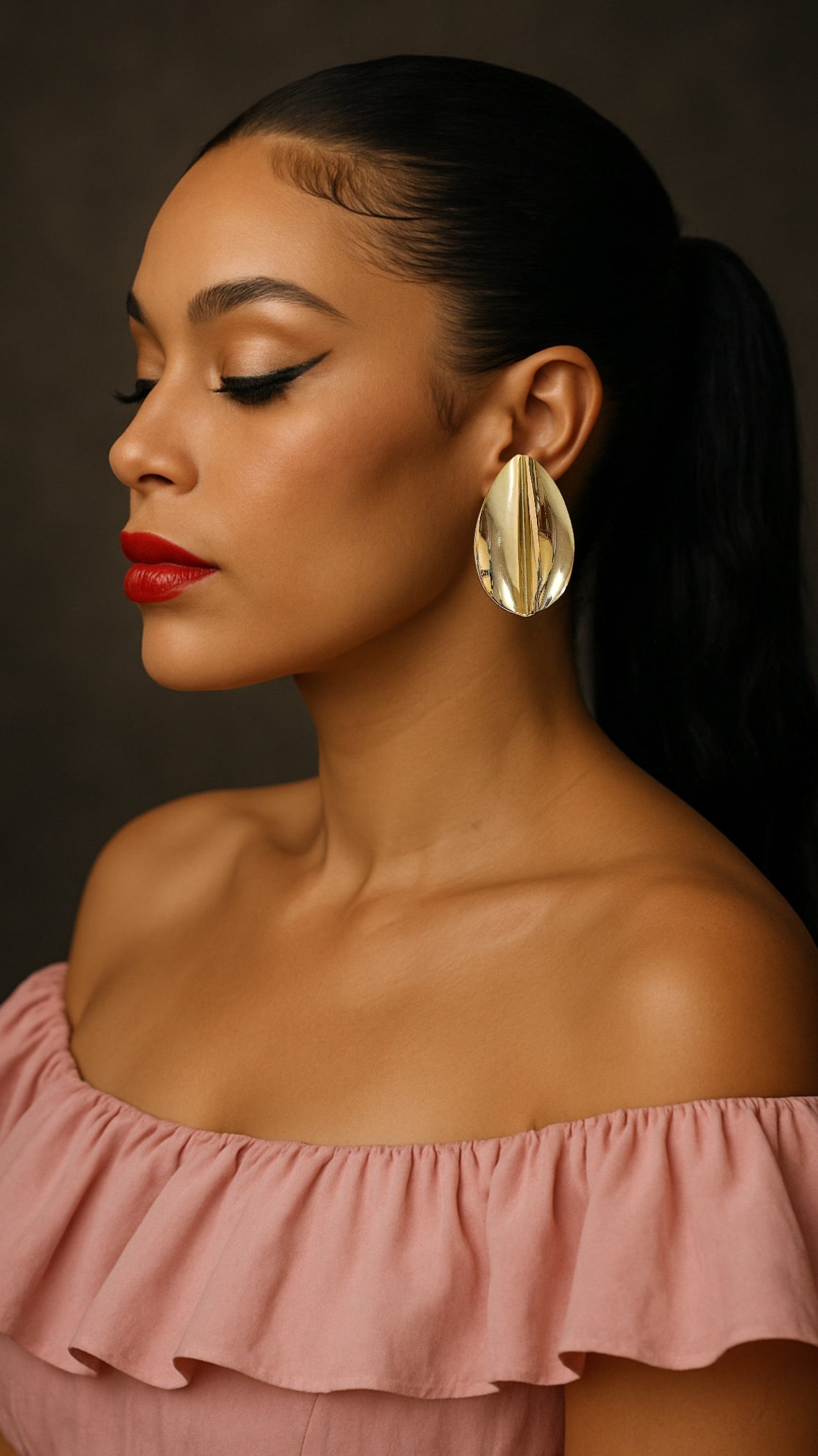 Oversized gold plated over brass leaf statement earrings for pierced ears.