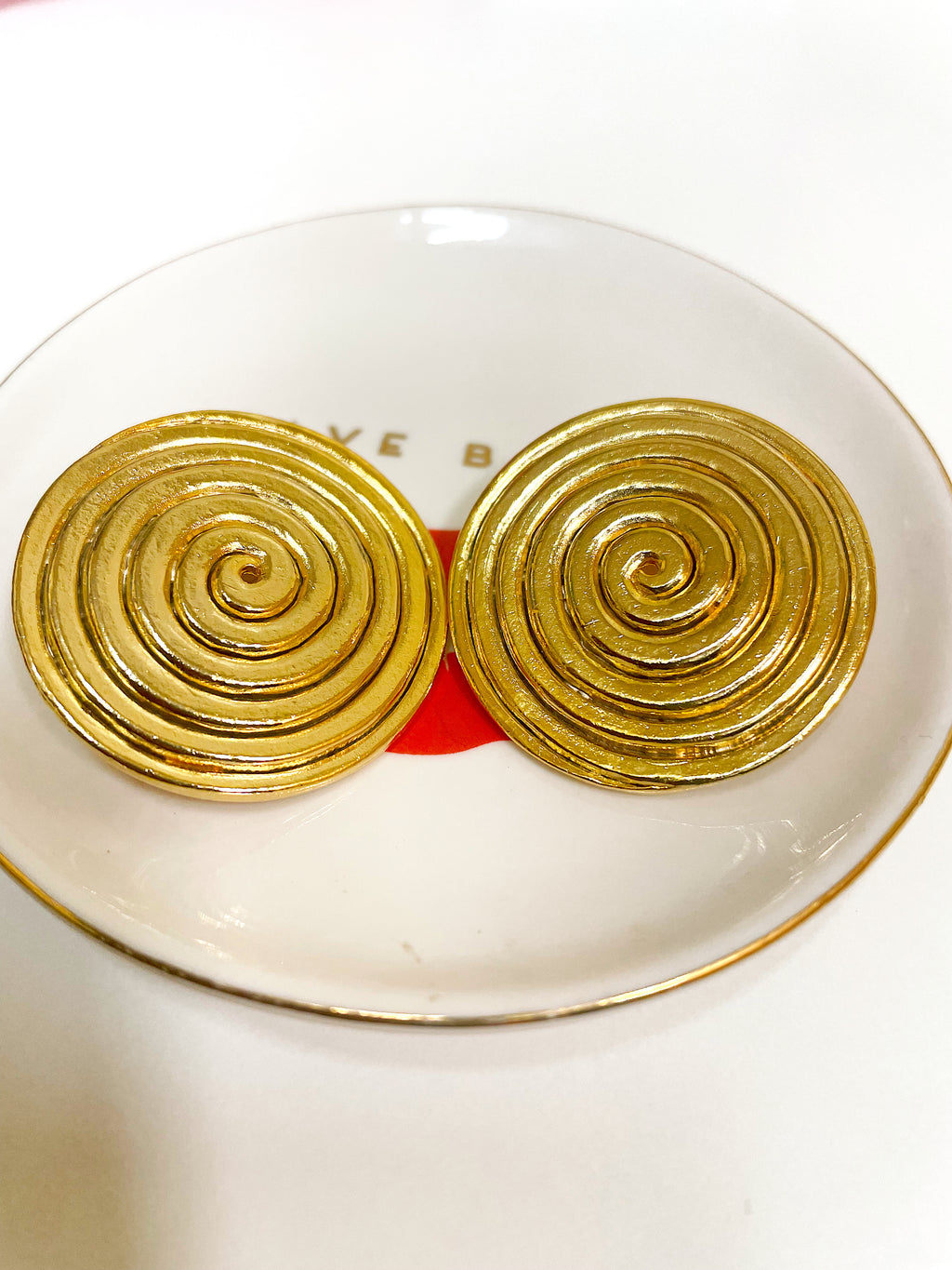 Large gold plated round swirl disc button clip on earrings.