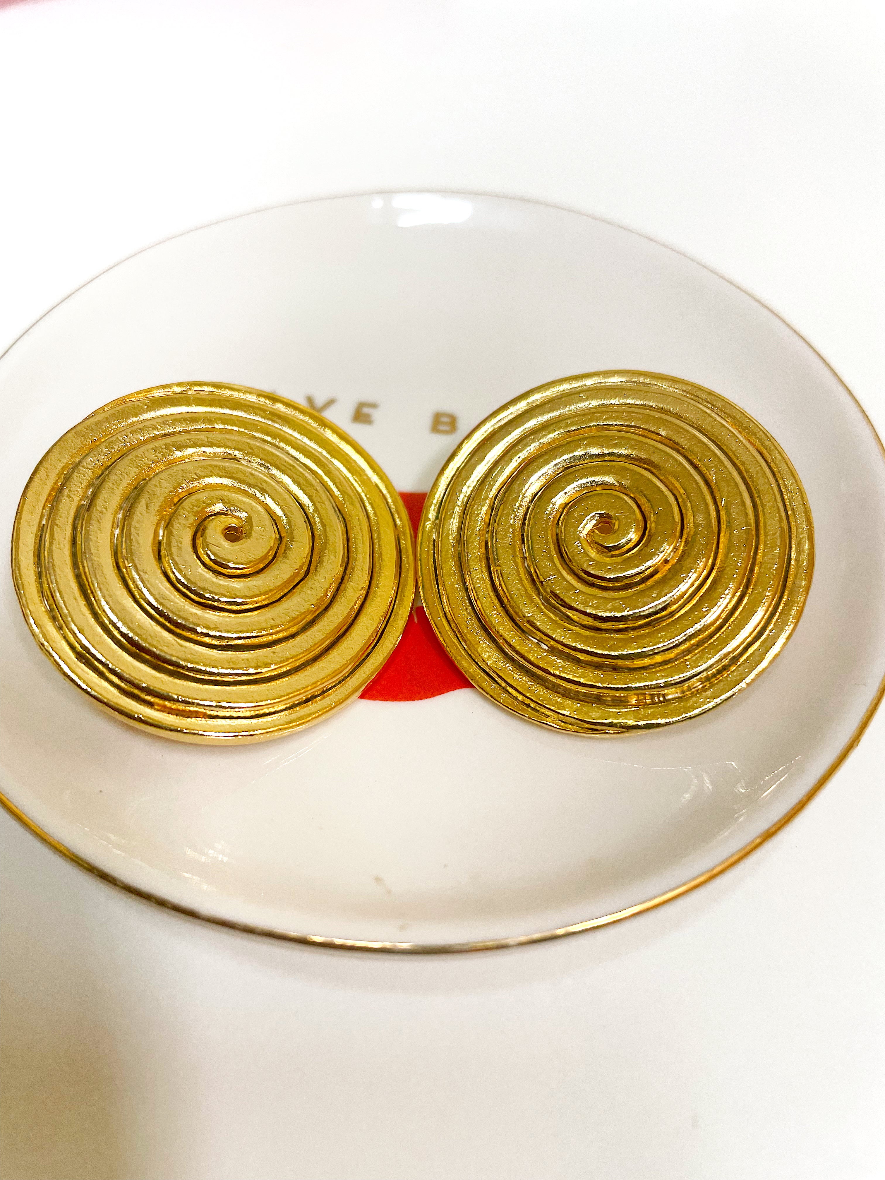 Large gold plated round swirl disc button clip on earrings.