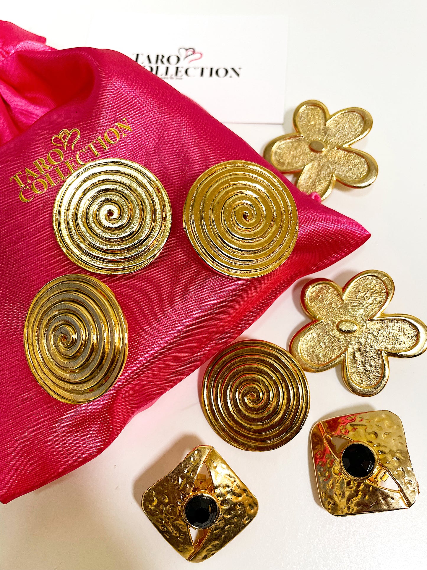 Large textured gold square earrings with black crystal stone.