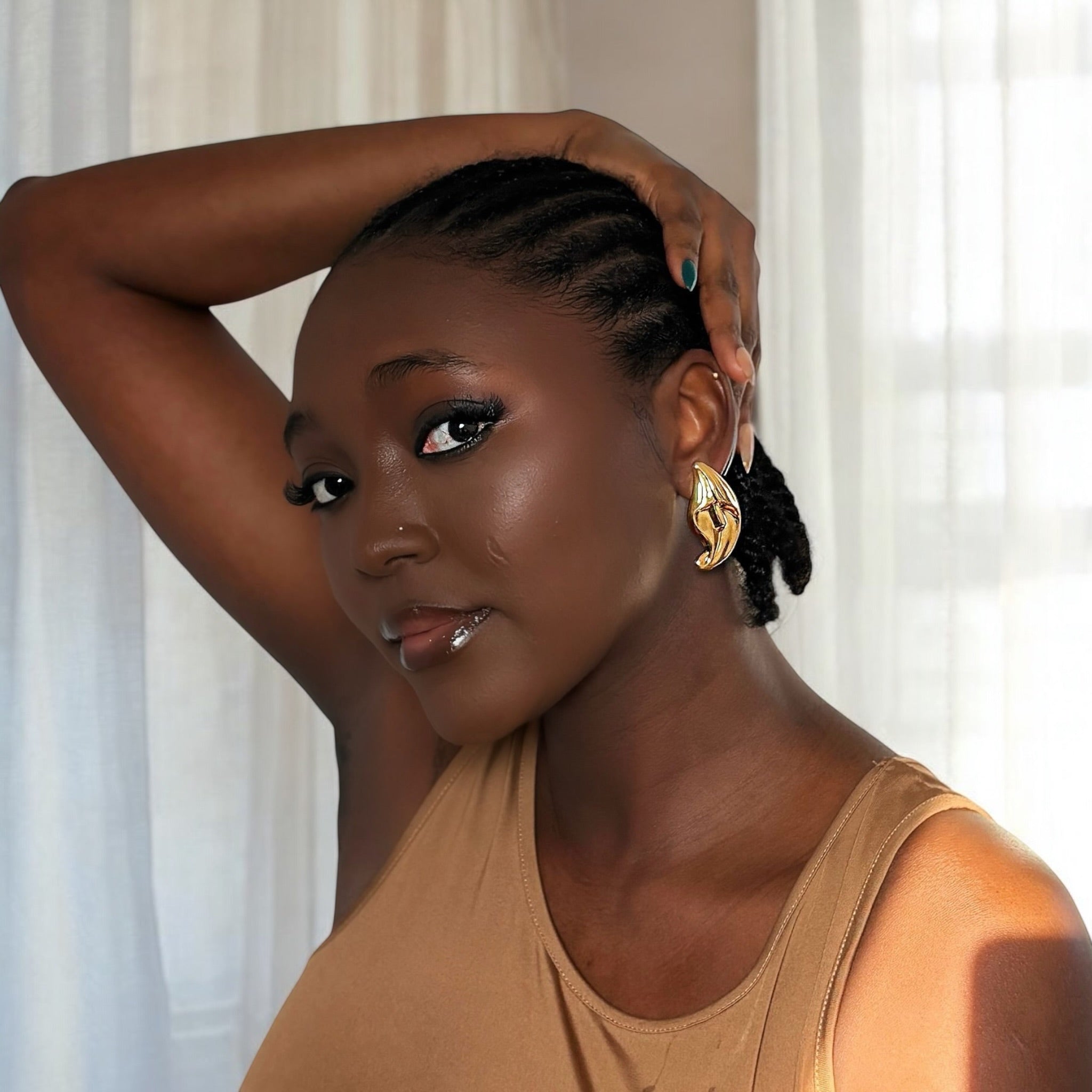 Peace lily flower gold stud statement earrings for pierced ears.