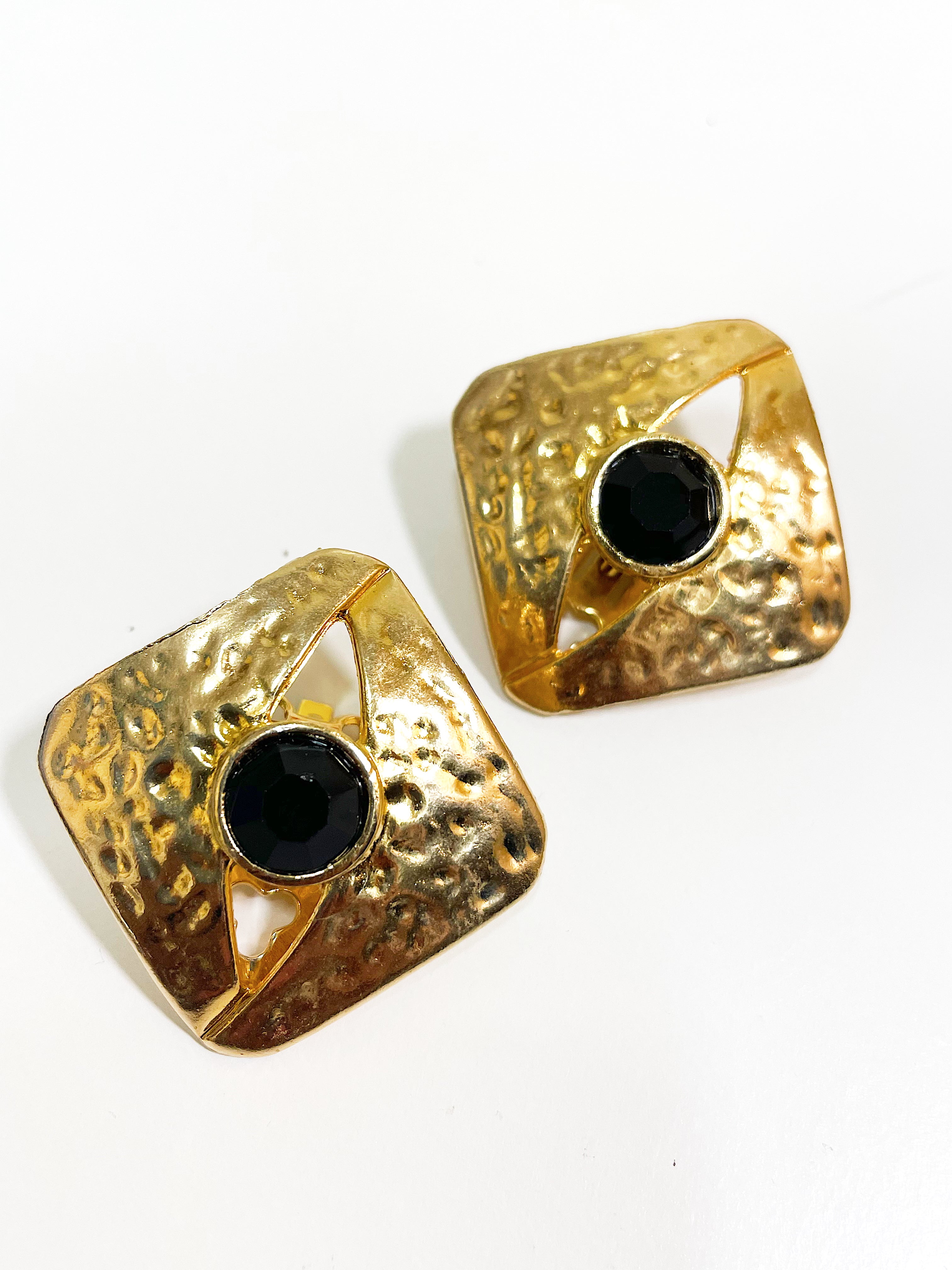 Large textured gold square earrings with black crystal stone.