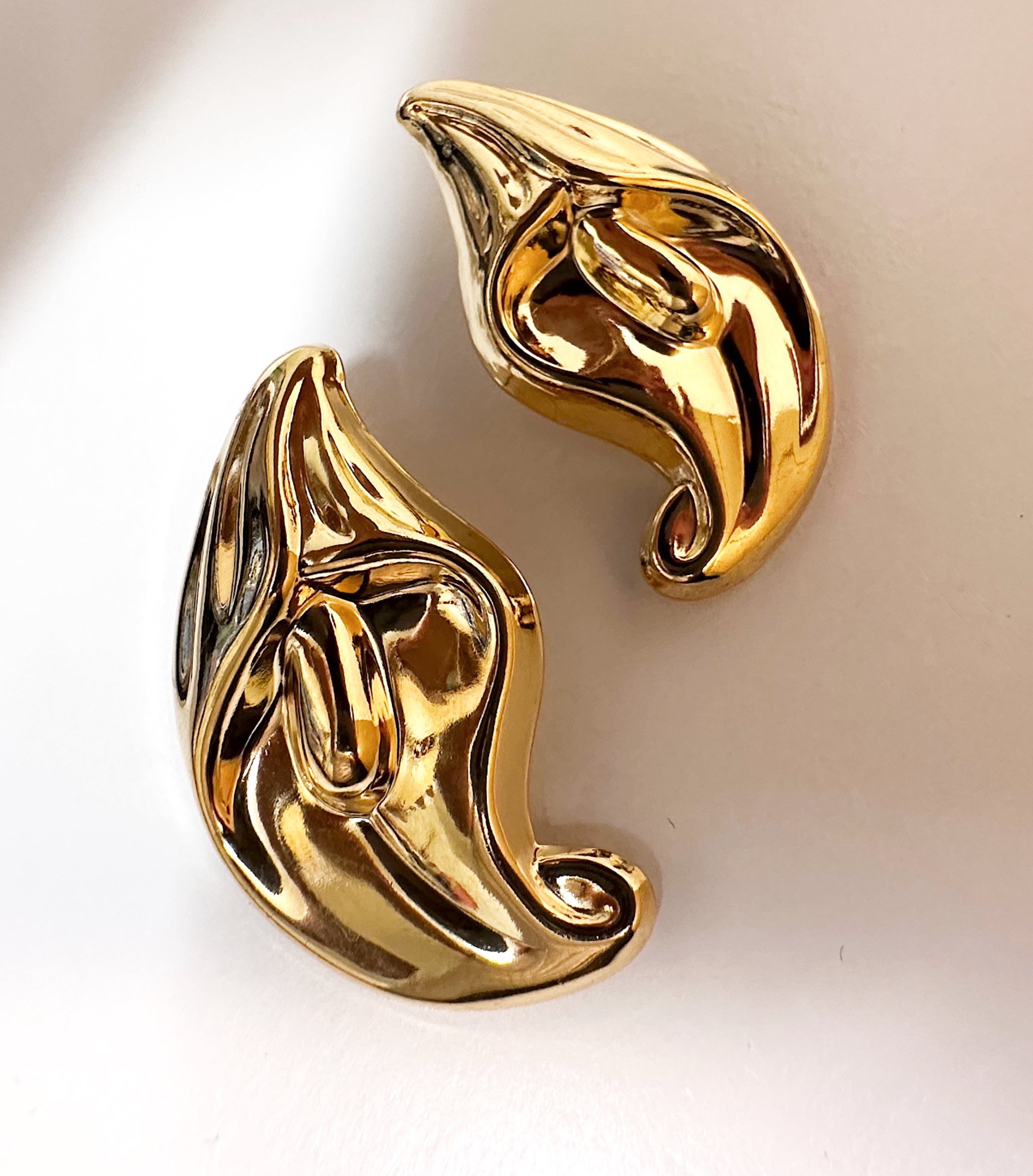 Peace lily flower gold stud statement earrings for pierced ears.