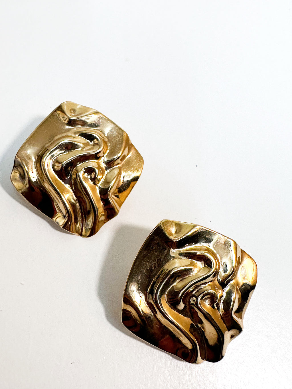Retro style textured gold plated square clip on earrings.