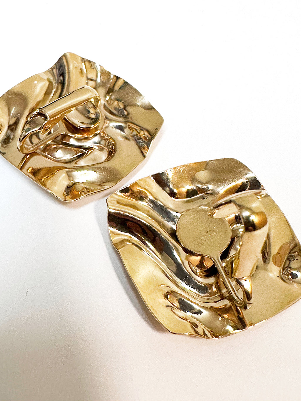 Retro style textured gold plated square clip on earrings.