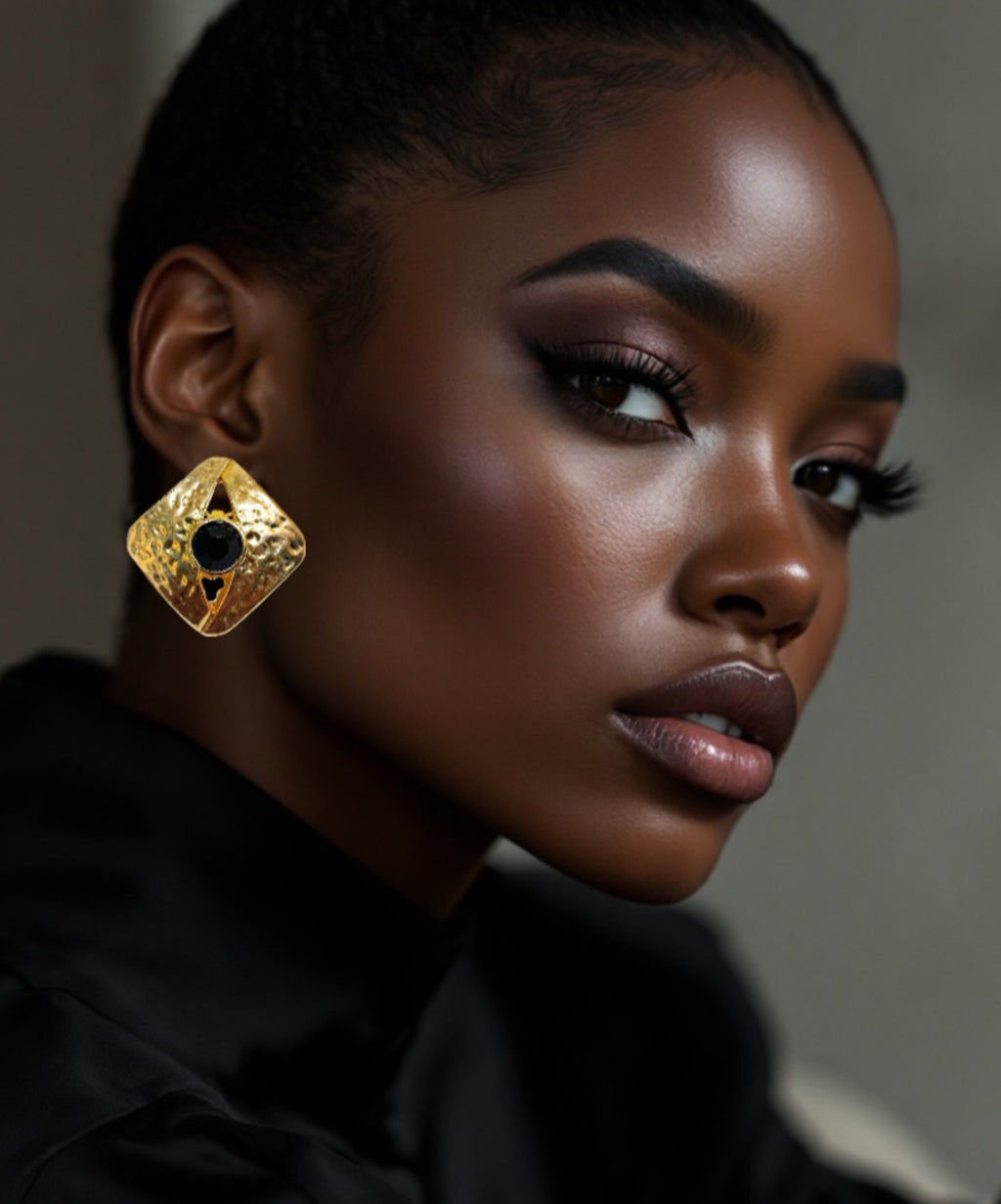 Large textured gold square earrings with black crystal stone.
